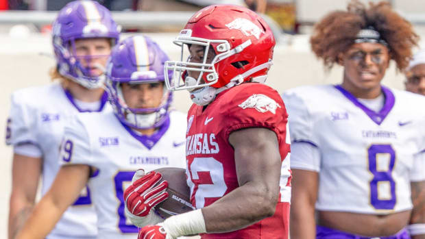 Razorbacks linebacker Brad Spence returning an interceptions for a score in opener against Western Carolina